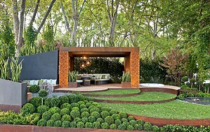 Modern outdoor living pavilion with Corten steel frame and concrete planters in Melbourne show garden