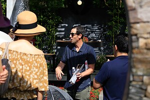 Landscape designer reviewing construction documents during Mandala Moon Gate Garden installation in Nagasaki, Japan