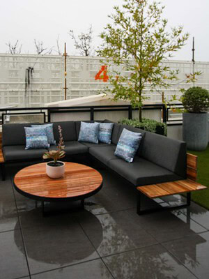 Rooftop terrace with blackbutt decking, outdoor dining table, lounge seating and city views in St Kilda