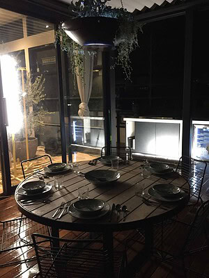 Blackbutt timber decking with outdoor kitchen and dining setup on St Kilda rooftop terrace from The Block