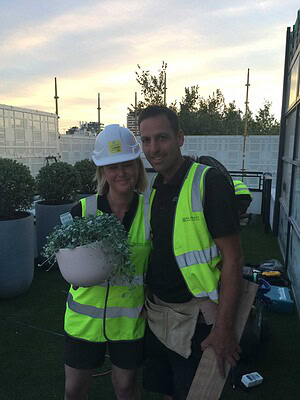Two construction workers in high-vis vests on St Kilda Gatwick rooftop terrace during The Block build